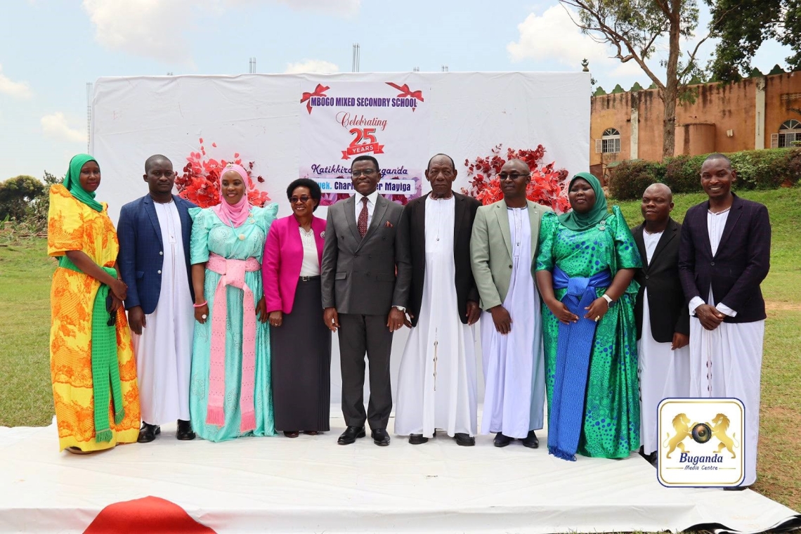 Hon. Choltilda Nakate and the Katikkiro with the school board